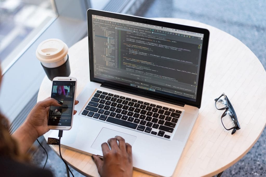 working with laptop and phone