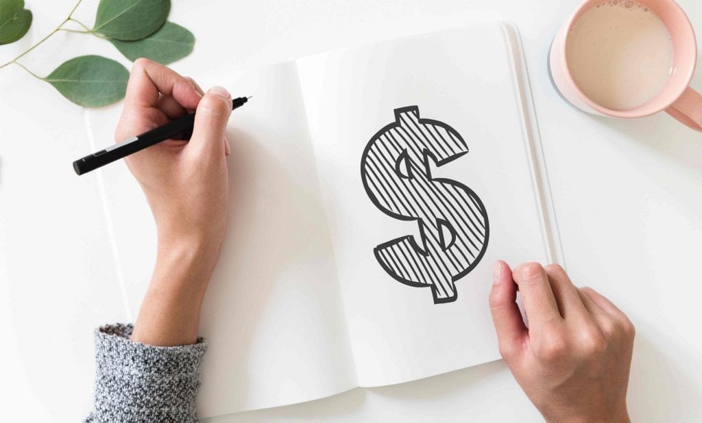 woman with a notebook and a dollar sign