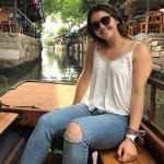 a girl wearing a shades and a white top, CHINA'S FOREIGN EXCHANGE STUDENT PROGRAM