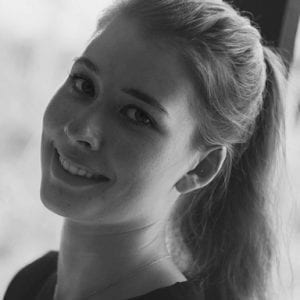 study in bali, blonde Girl smiling at the camera in black and white