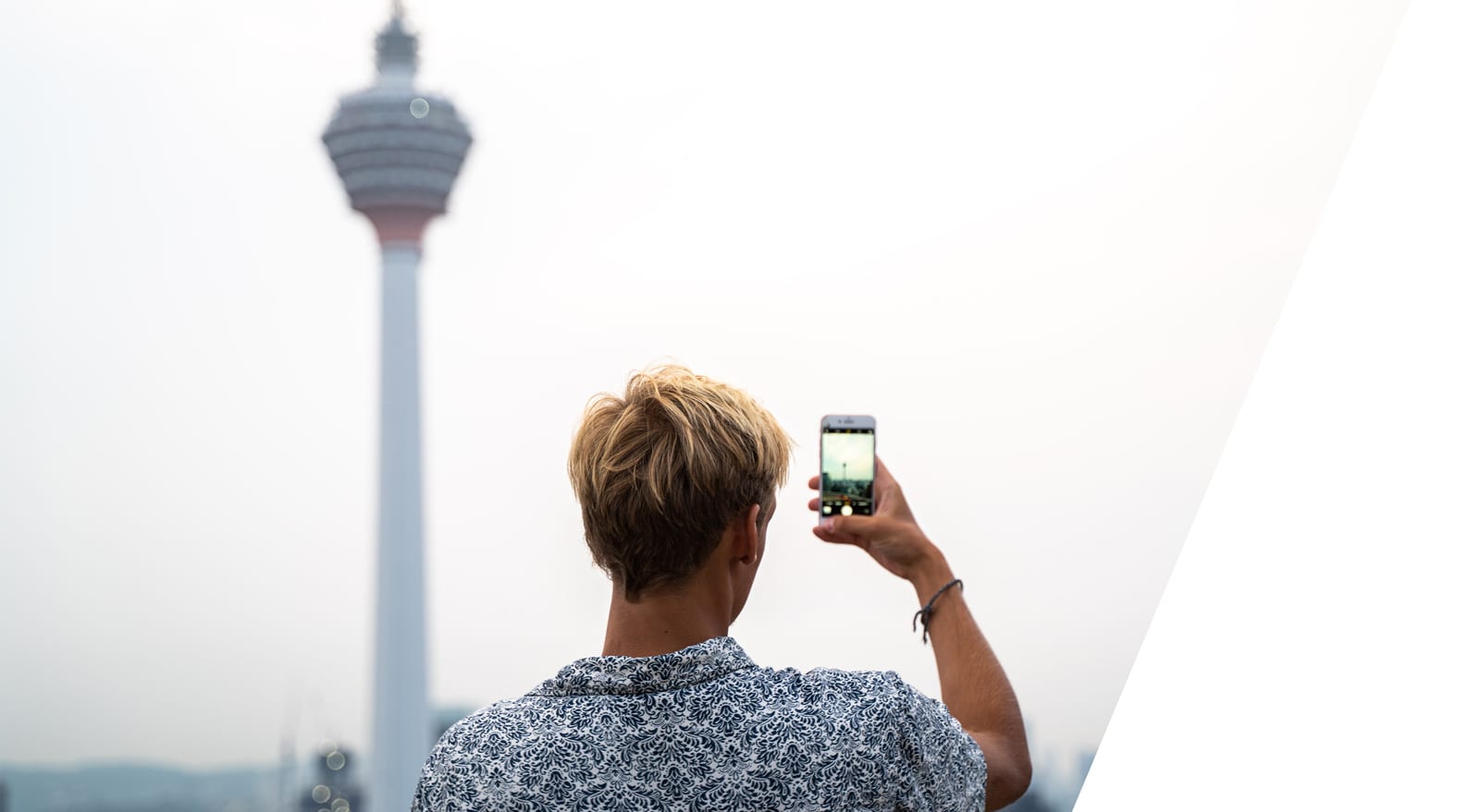 student taking photo of the KL tower