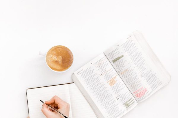 writing hand writing hand with a book and coffee